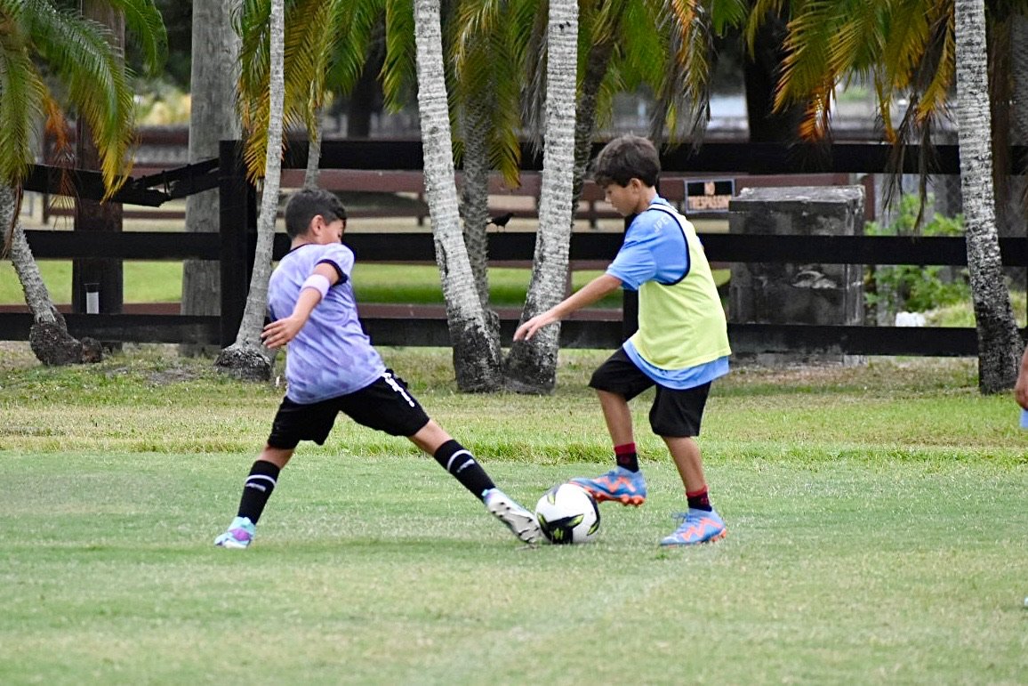 Another child playing soccer